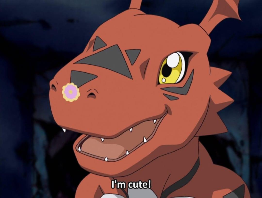 Guilmon adorable red dinosaur Digimon with yellow eyes and innocent expression