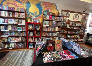 Beyond the Panels: The Multi-Billion Dollar Business of Comic Books An interior shot of a comic book store, filled with shelves of comics and graphic novels.