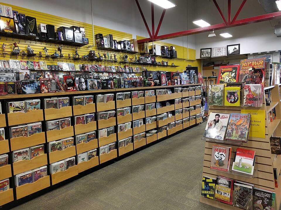 Rows of back-issue comic long boxes in a comic shop