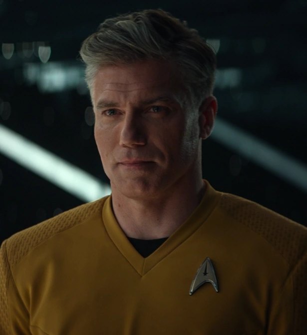 Captain Christopher Pike in a gold Starfleet uniform aboard the Enterprise