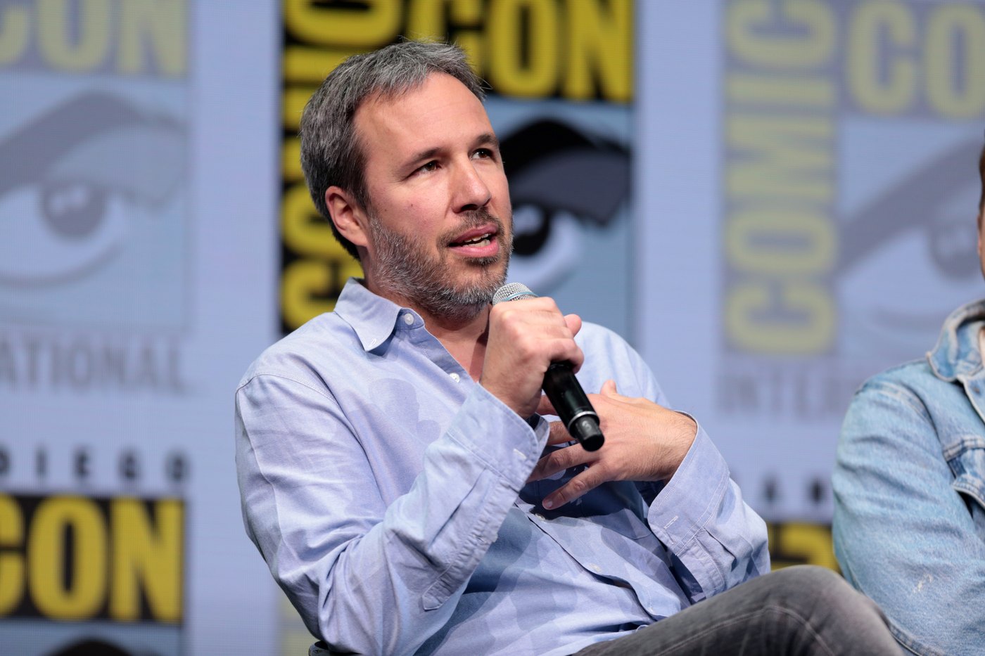 Director Denis Villeneuve speaking at a convention panel