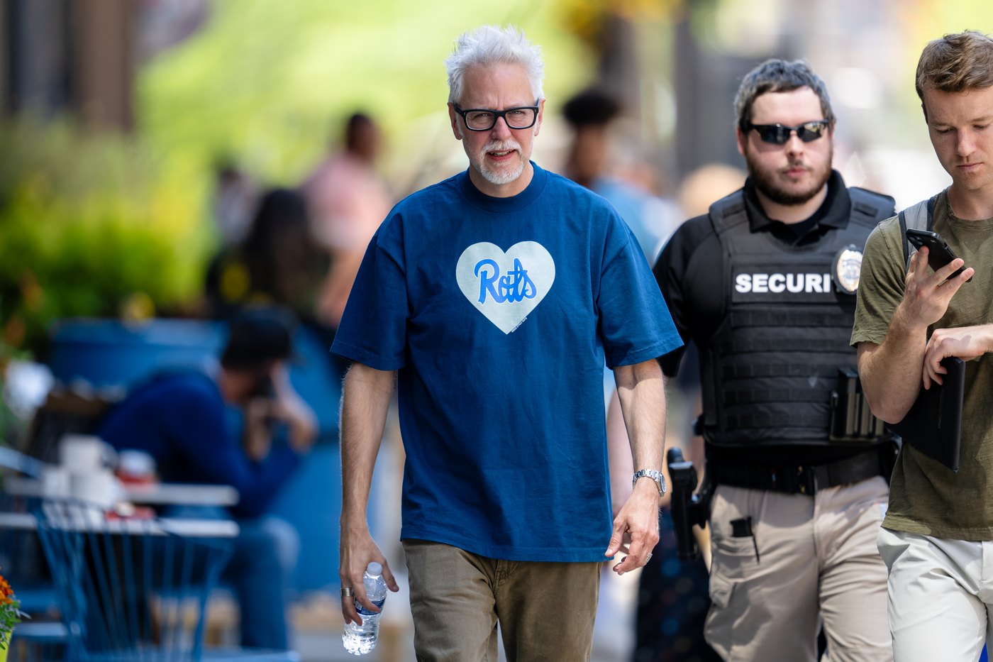 James Gunn walking in public wearing a blue T-shirt