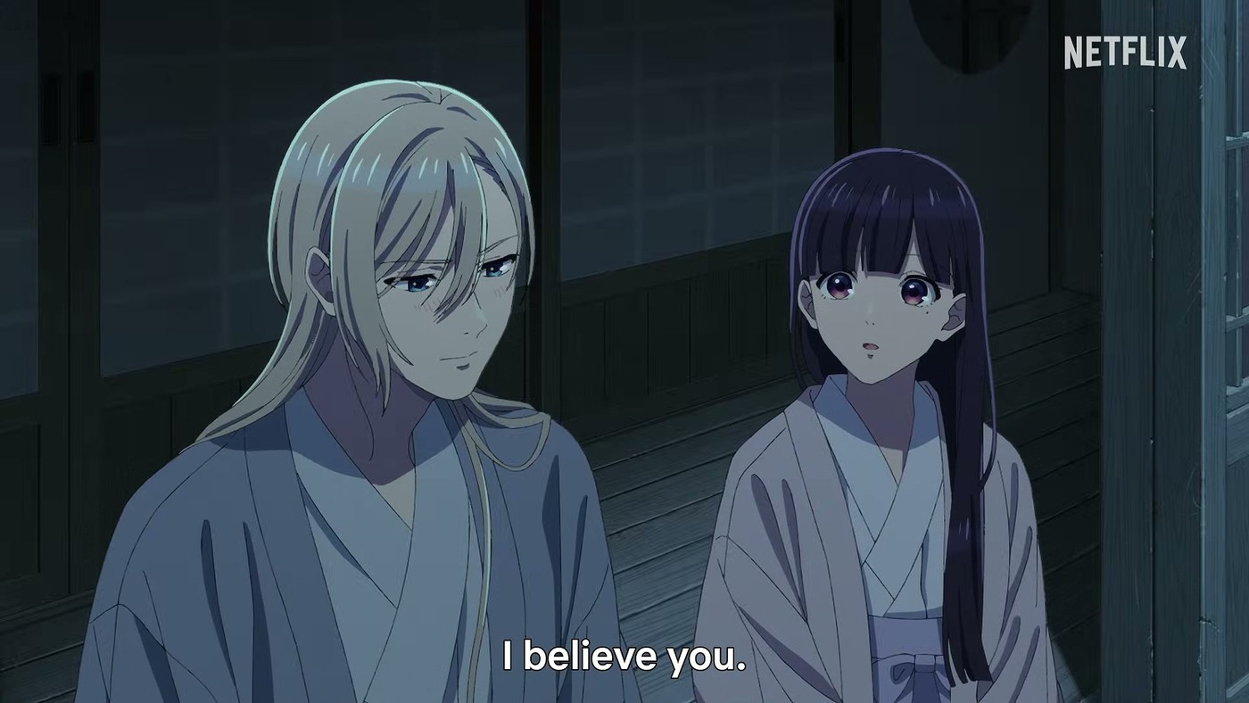 Kiyoka Kudo, silver hair loose, sitting beside Miyo Saimori on a veranda at night, subtitled 'I believe you.'
