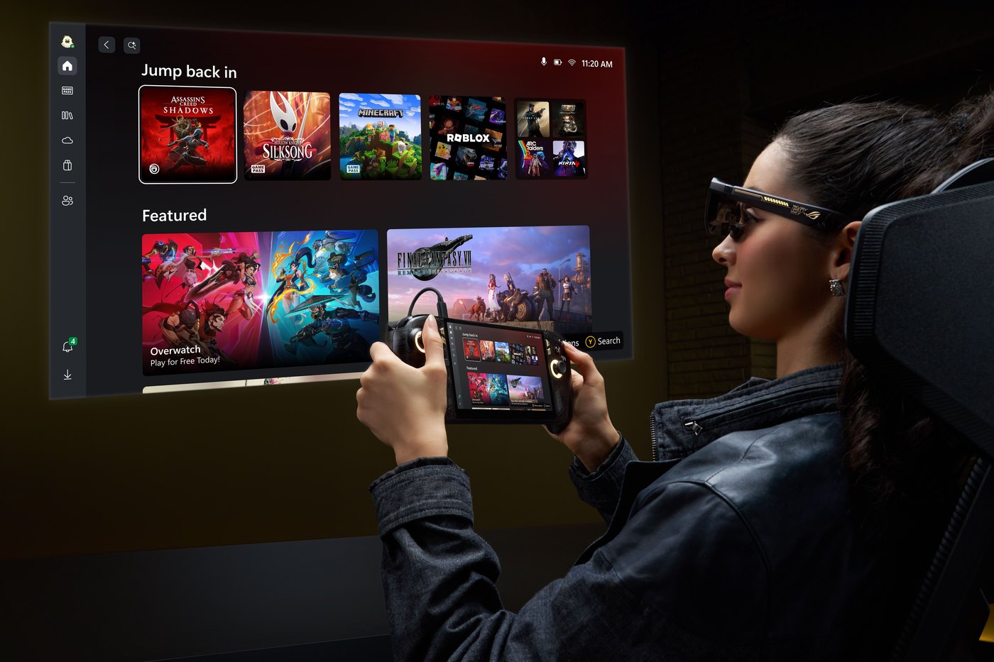 A person wearing ROG XREAL R1 Edition AR glasses while holding the ROG Xbox Ally X20