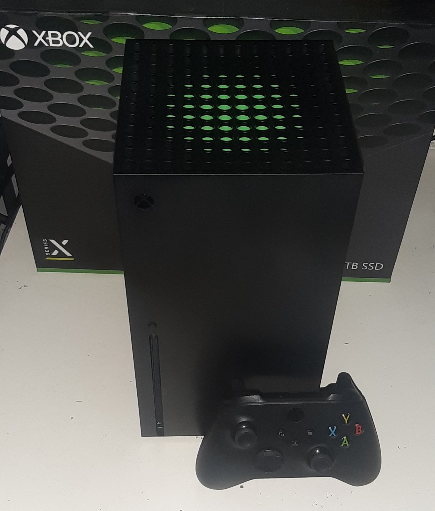 An Xbox Series X console and controller