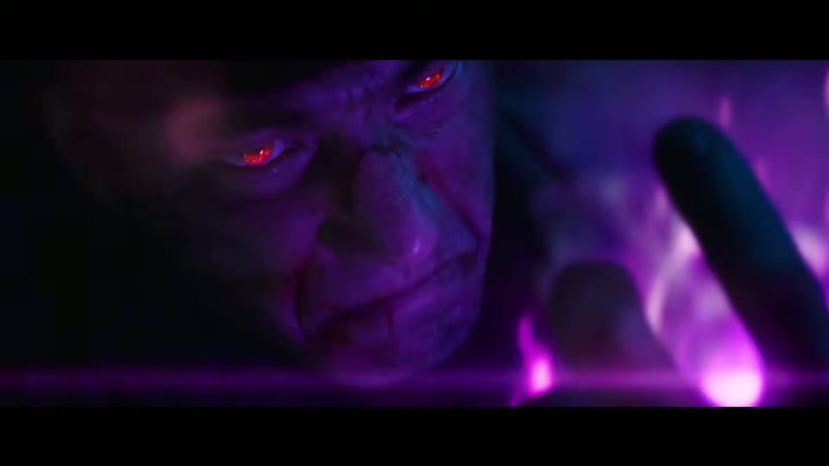 A face lit by purple energy with glowing eyes in the Street Fighter trailer cold open