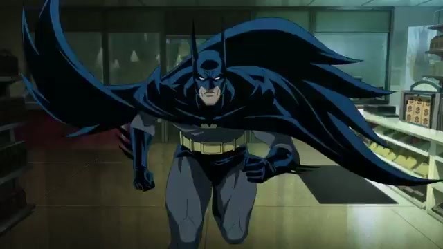 Batman in his classic black suit swings through a Gotham storefront in the Knightfall Part 2 trailer
