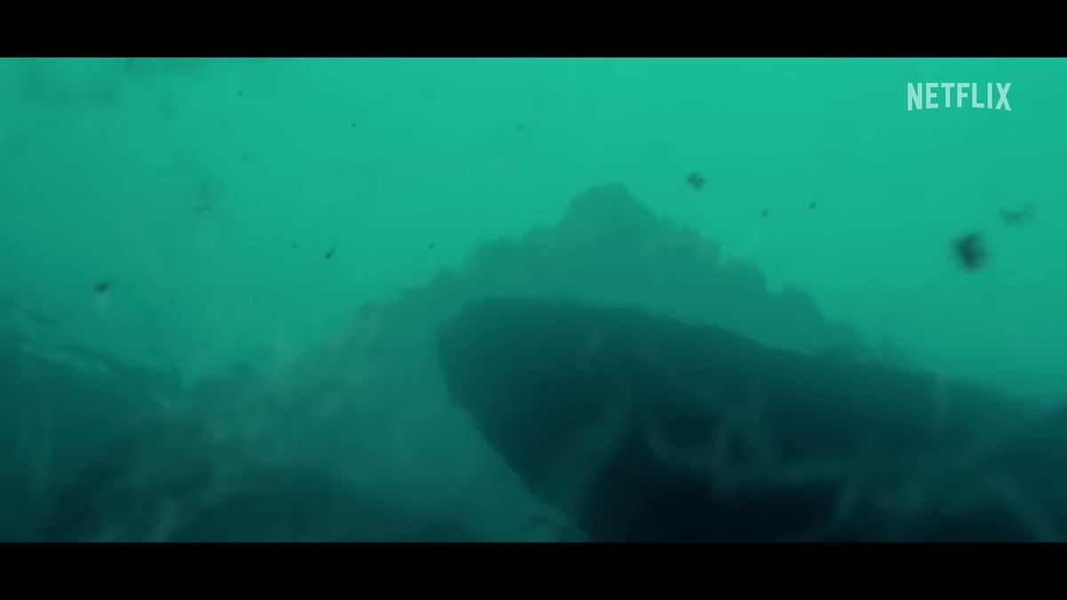 A large dark shape underwater in the July teaser for Below