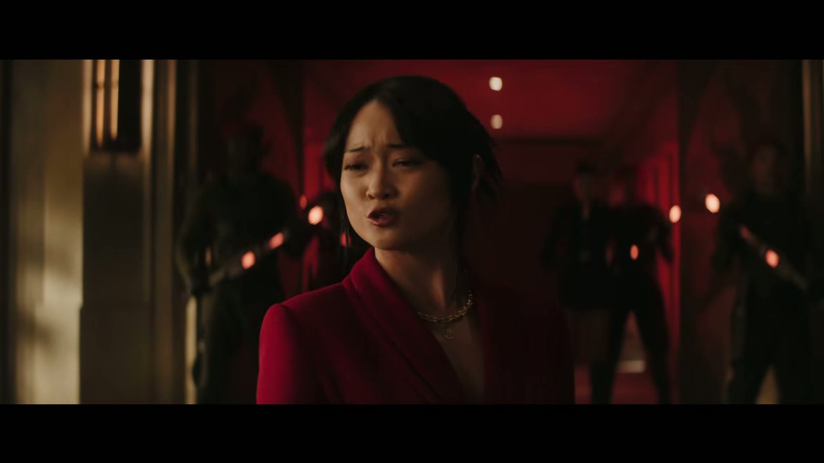 Chun-Li in a red dress in a red-lit corridor