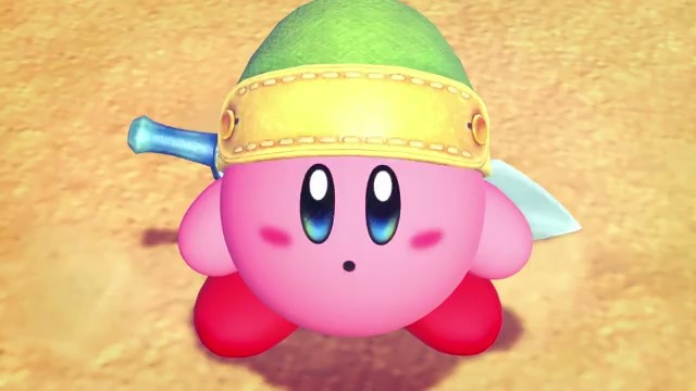 Kirby wielding a sword and wearing a green hat in Kirby and the World Beyond
