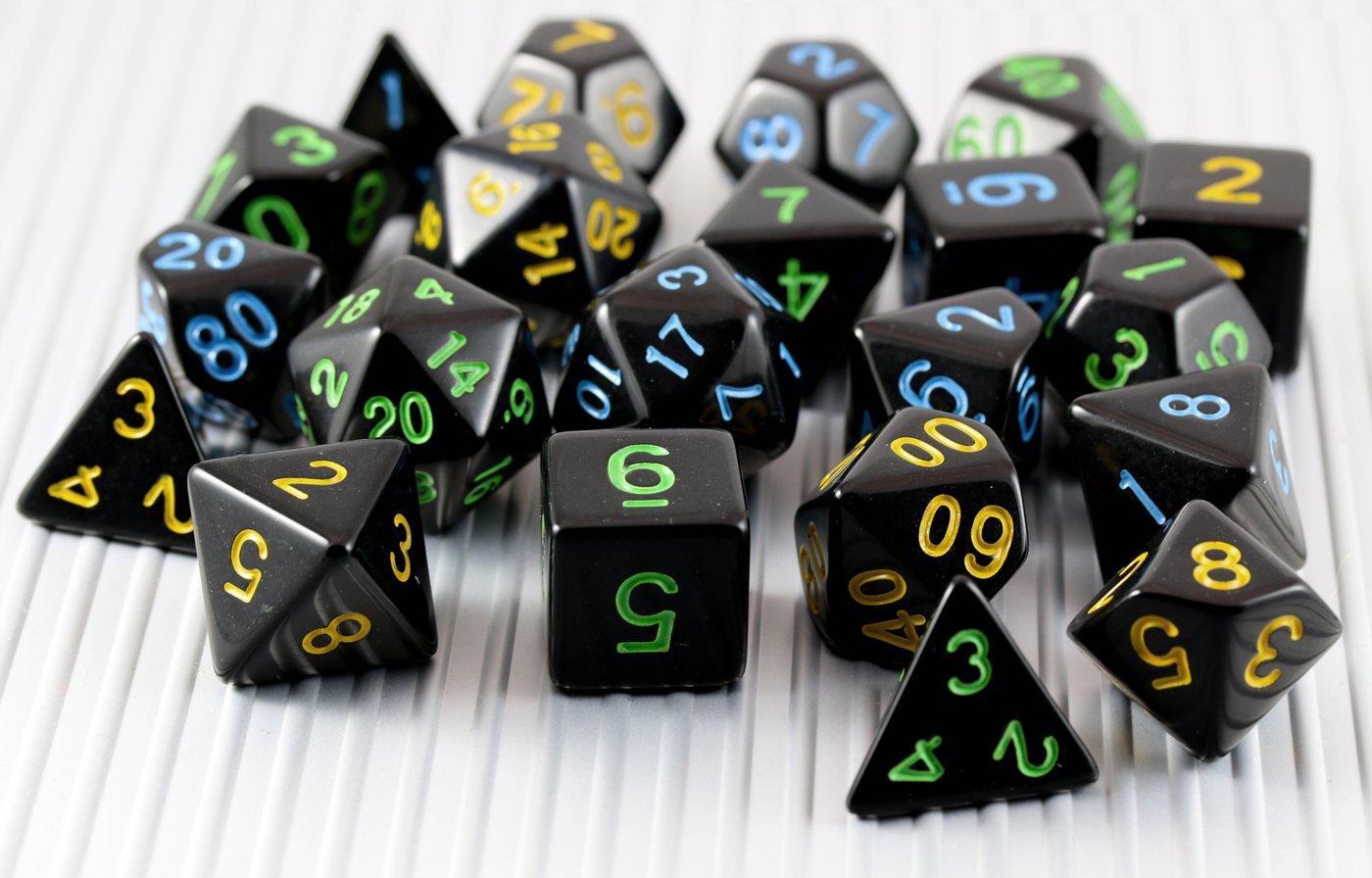 A set of polyhedral dice, the tabletop roots of Baldur's Gate 3's D&D 5e ruleset