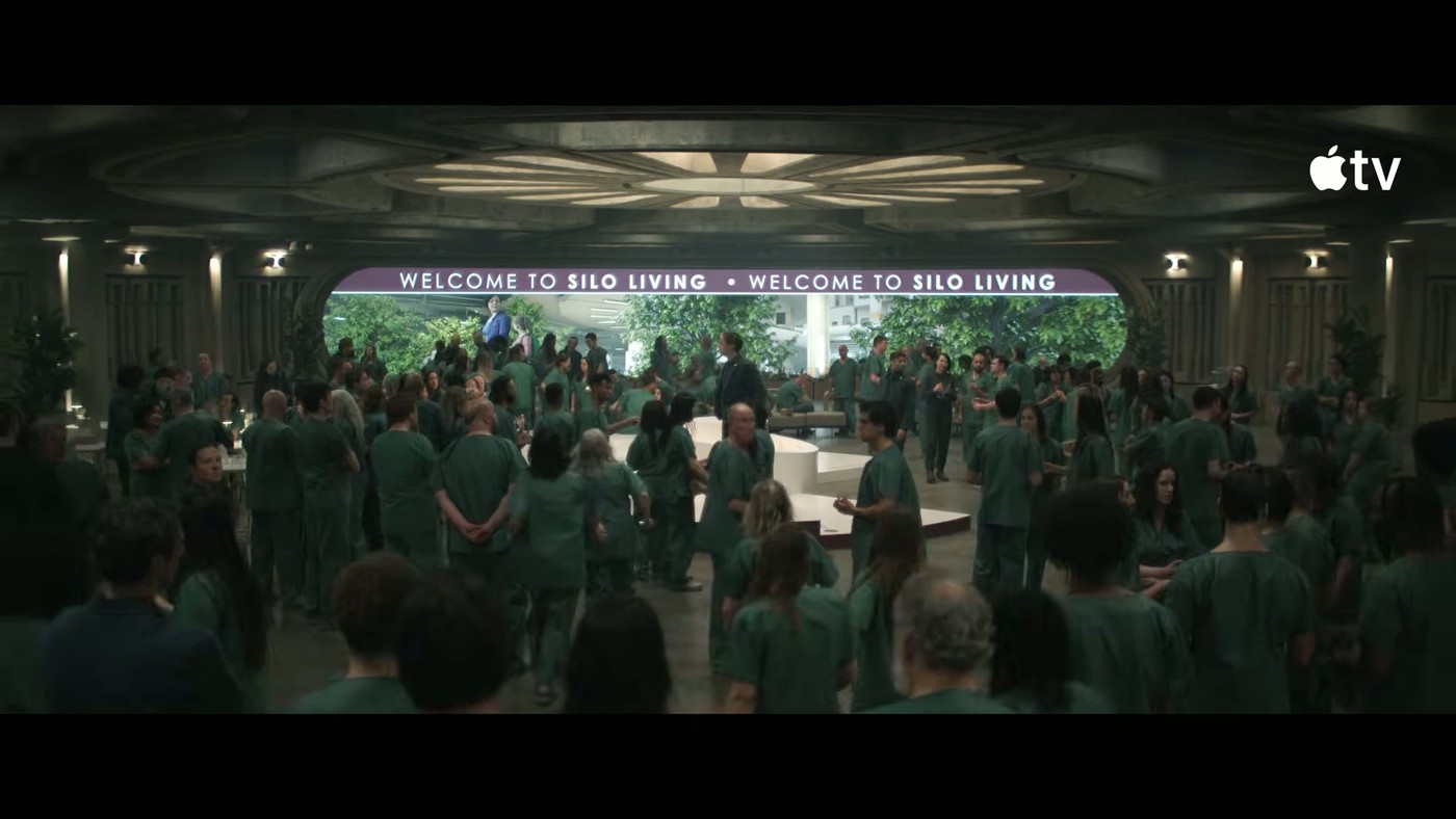 A large crowd assembled in a hall in the Silo Season 4 teaser