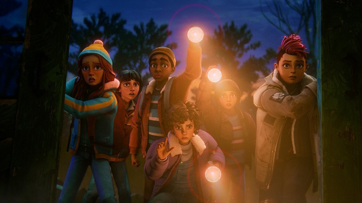 The Hawkins Investigators Club exploring a dark forest with flashlights
