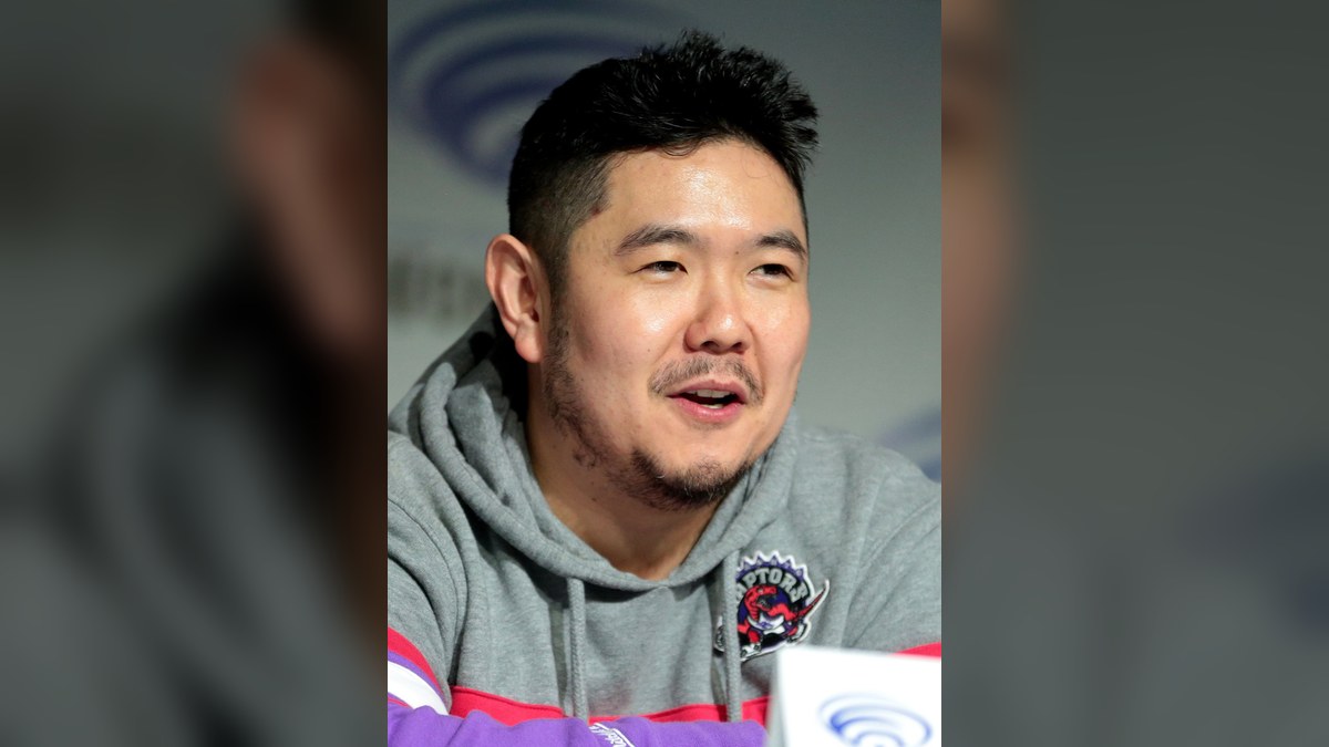 Eric Bauza speaking on a convention panel