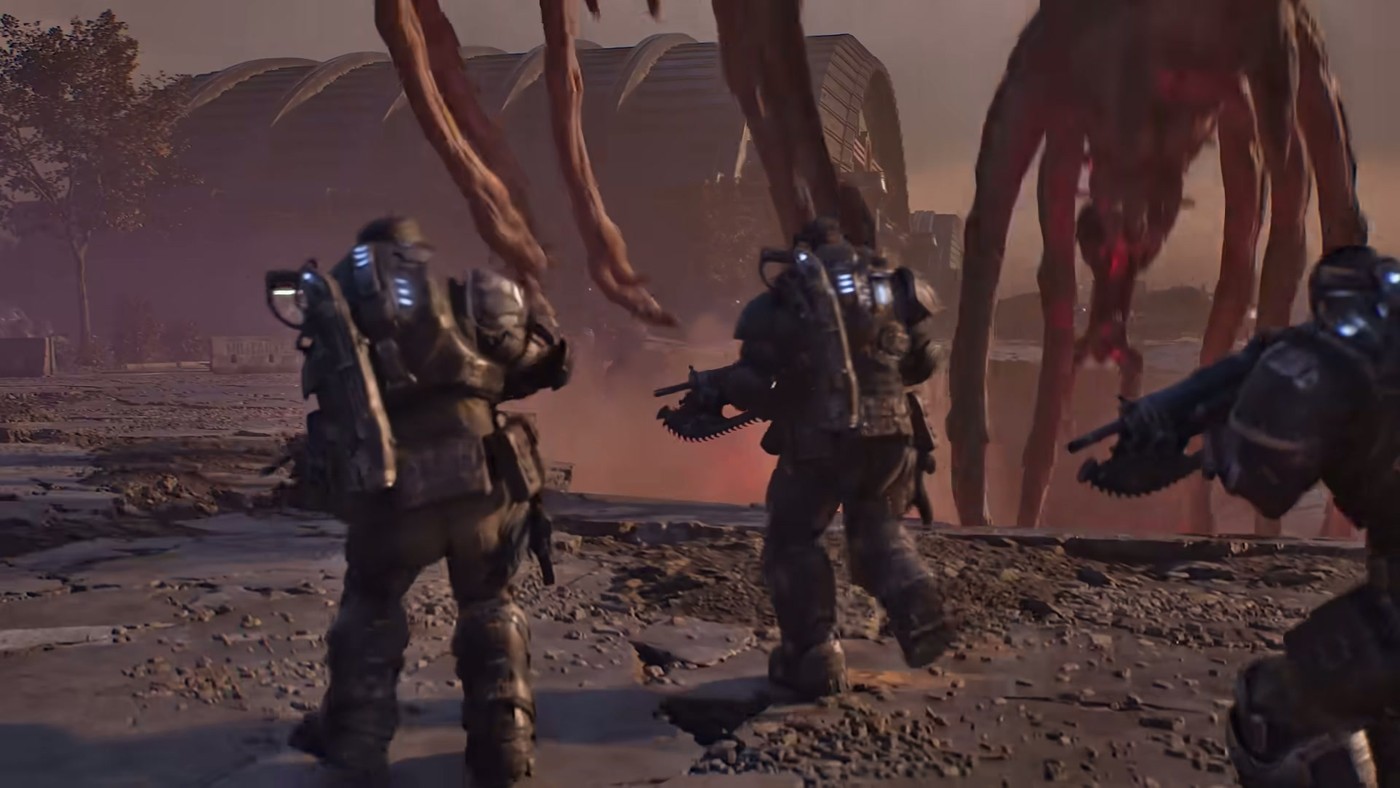 Bravo Squad raises weapons at a towering, spider-legged Locust creature in the Gears of War: E-Day launch trailer.