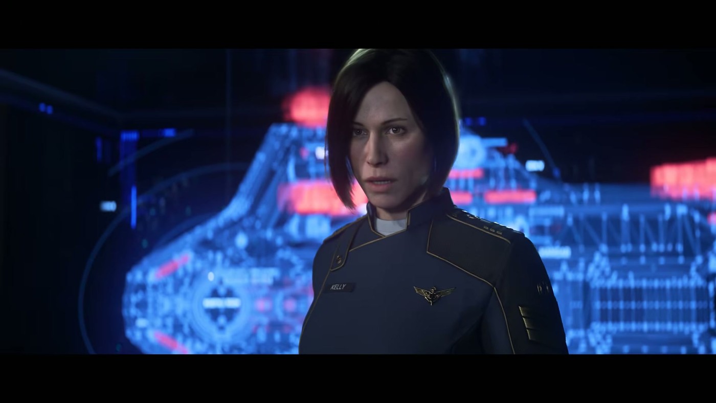 An officer standing in front of a blue holographic tactical display on a ship bridge